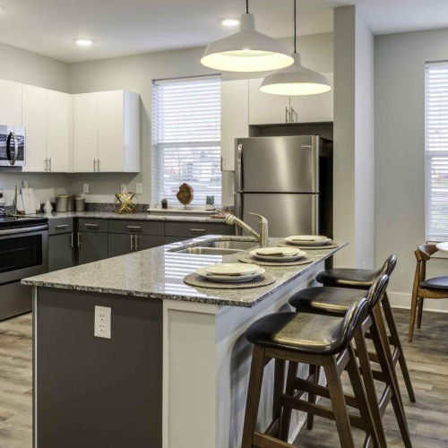 a kitchen with a table and chairs
