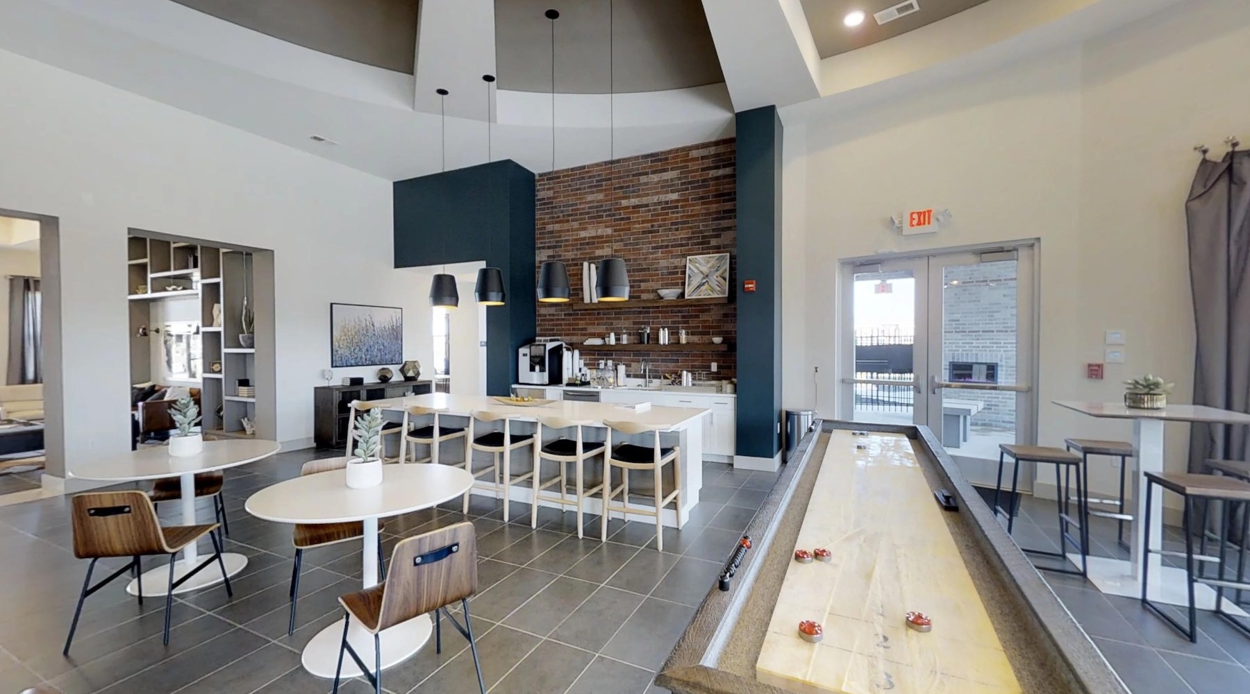a clubroom with tables and chairs