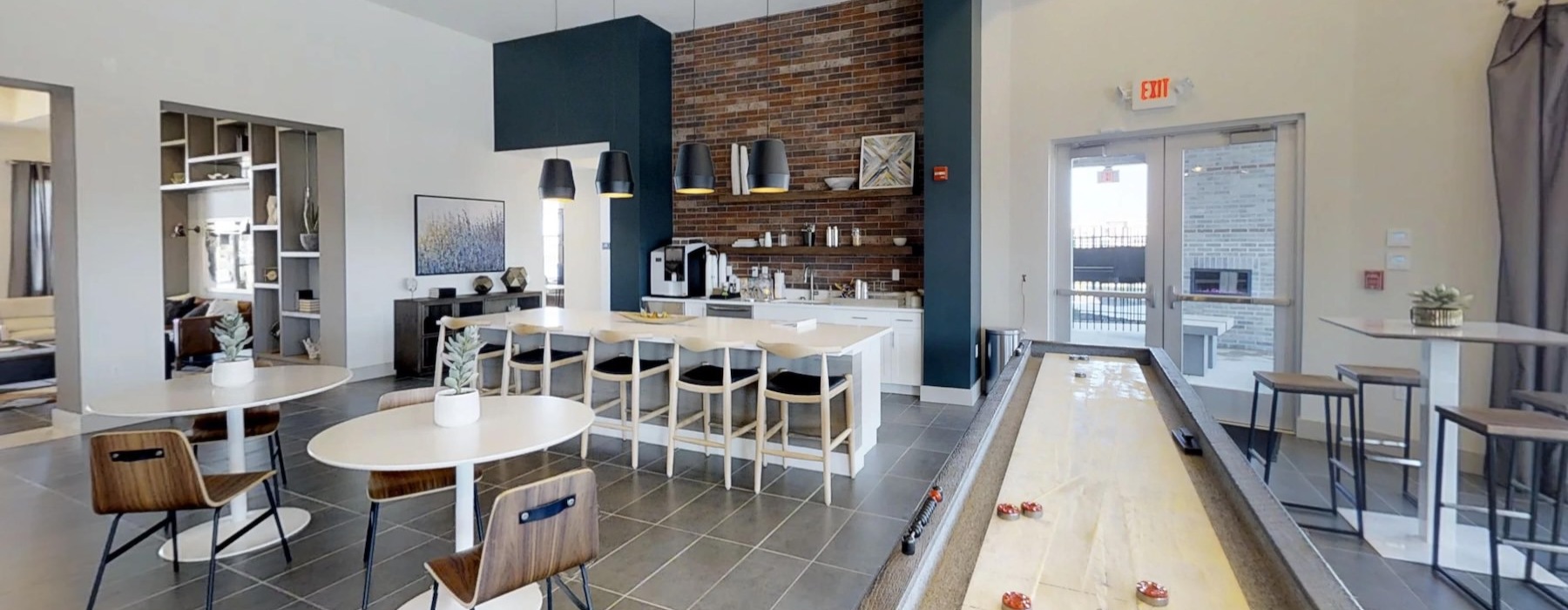 a clubroom with tables and chairs